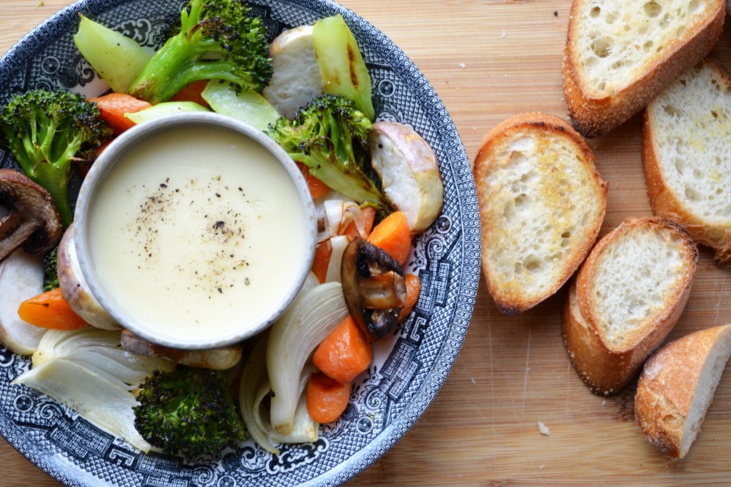 Roasted vegetables with cheese sauce and toasts